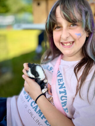 Holding a baby bunny in her arms was a sure way to bring a smile to her face!